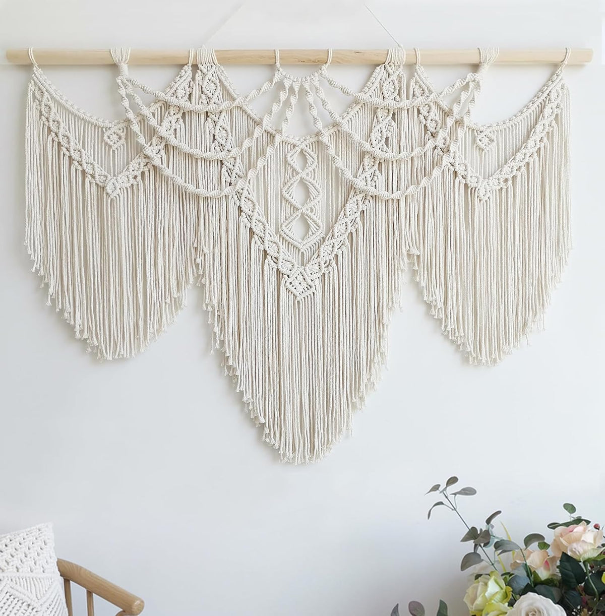Wide shot of three scalloped panels with draped loops and textured knotwork across the top rod.