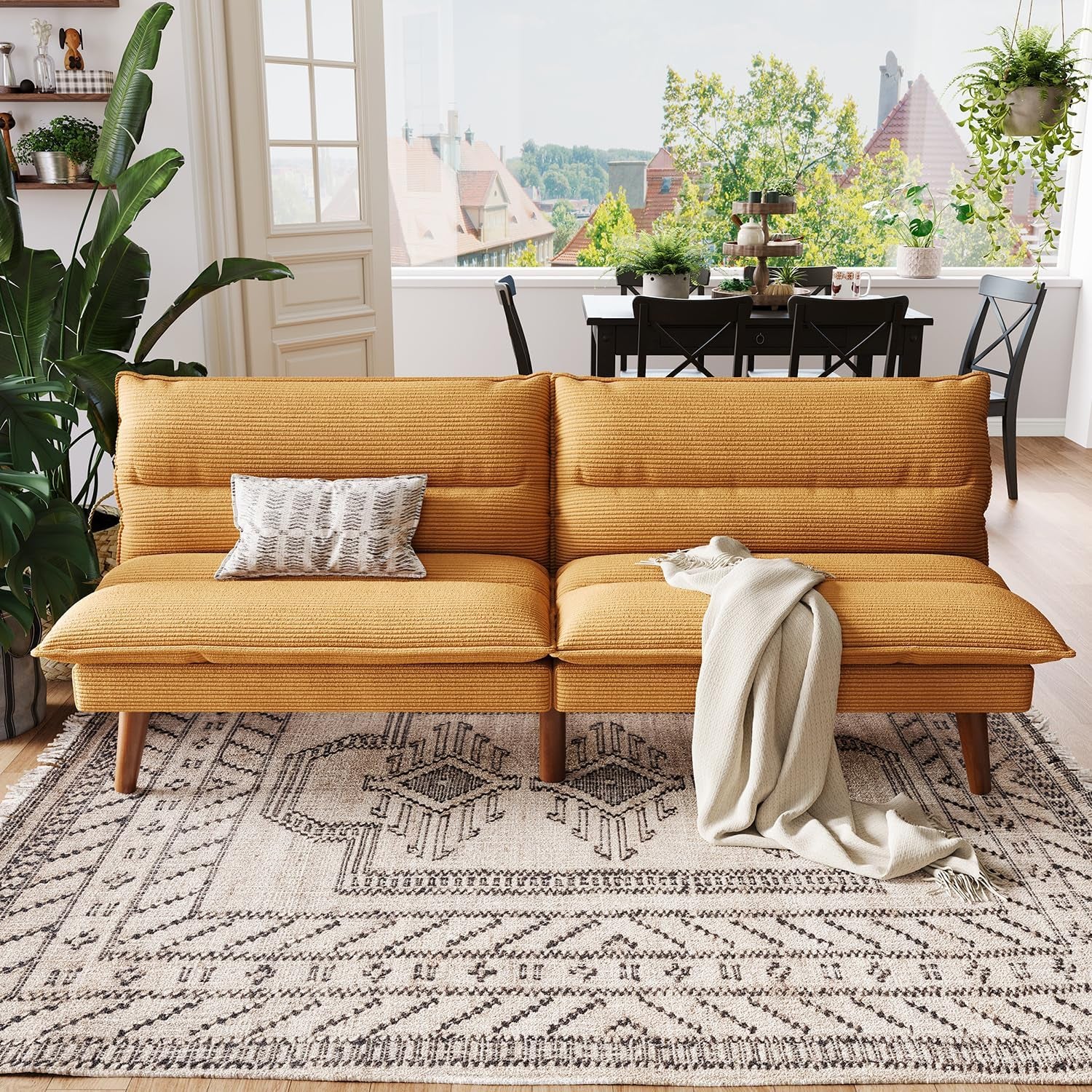 Front view of yellow corduroy futon sofa set as a two-seat loveseat with decorative pillows