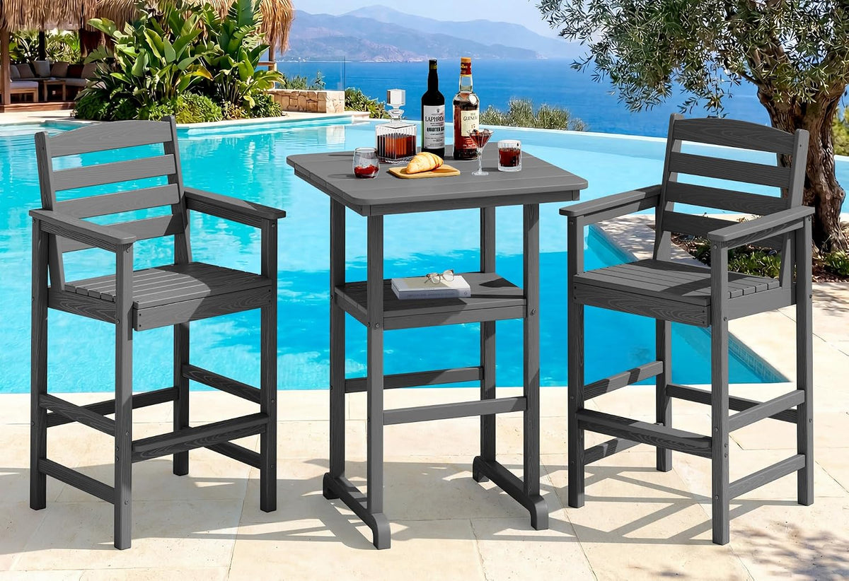 Poolside scene with two tall slatted armchairs and a square bar-height table in dark gray.