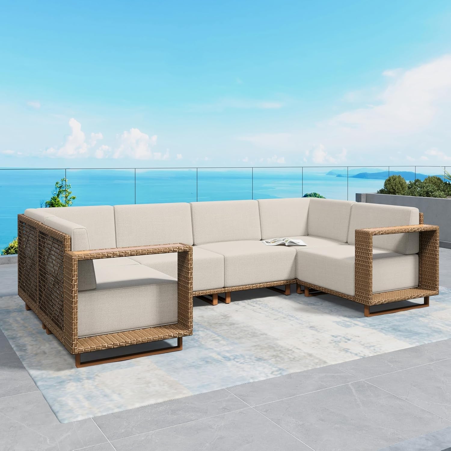 Side view of the L-shaped beige sectional showing woven rattan arm frames and corner seating on a rug.