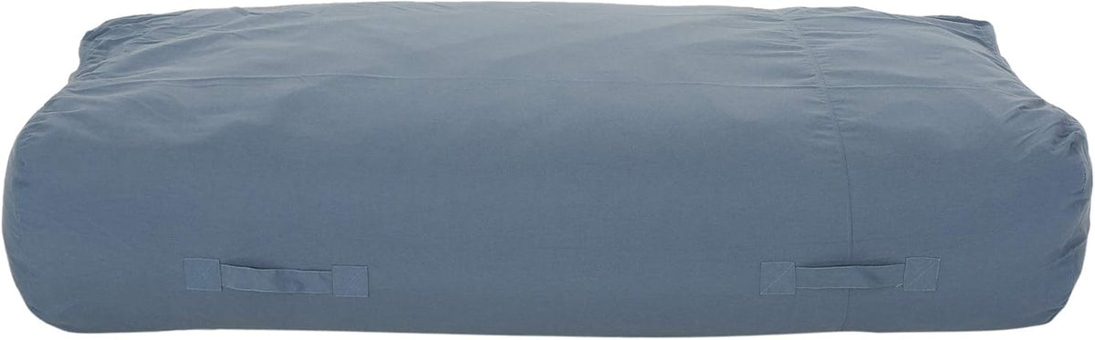Front view of a rectangular floor lounger in slate blue showing stitched seams and two handles.