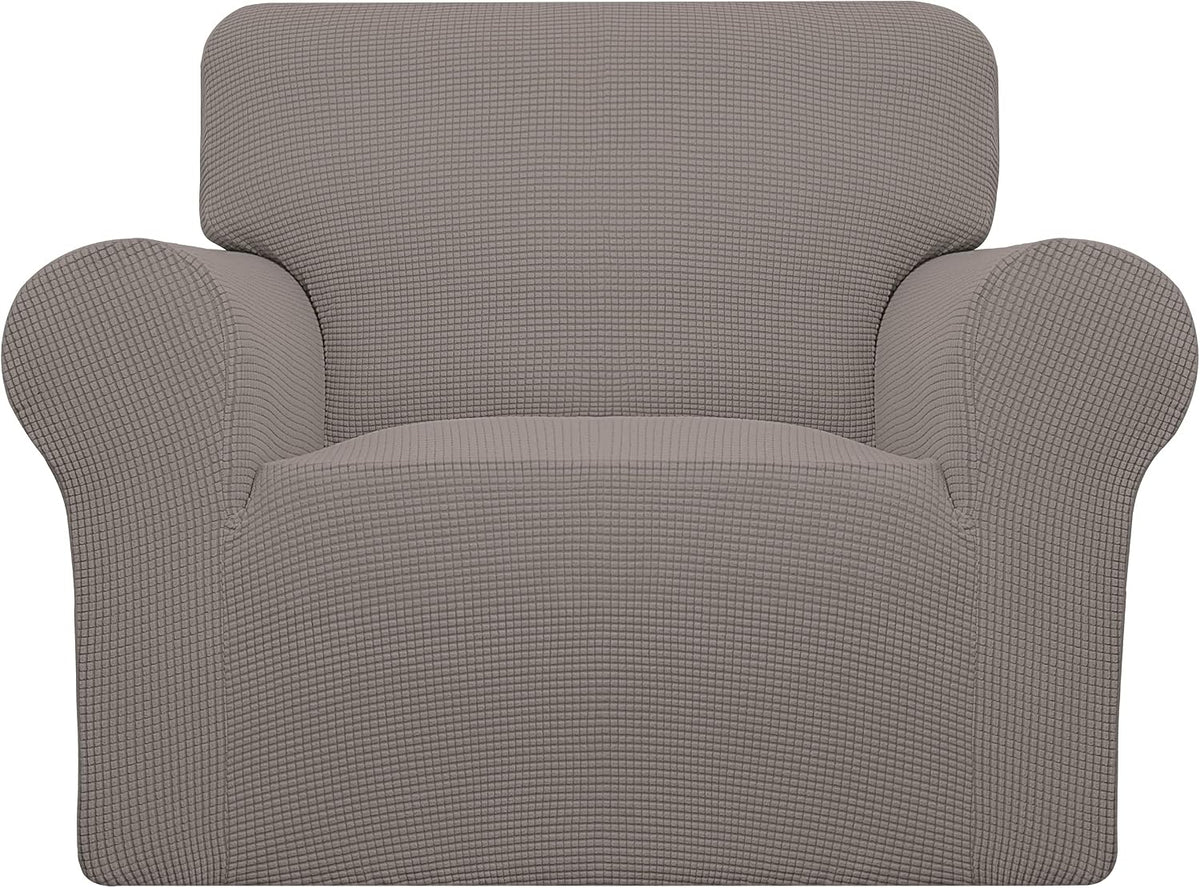 Front view of an armchair dressed in a muted taupe textured stretch slipcover.