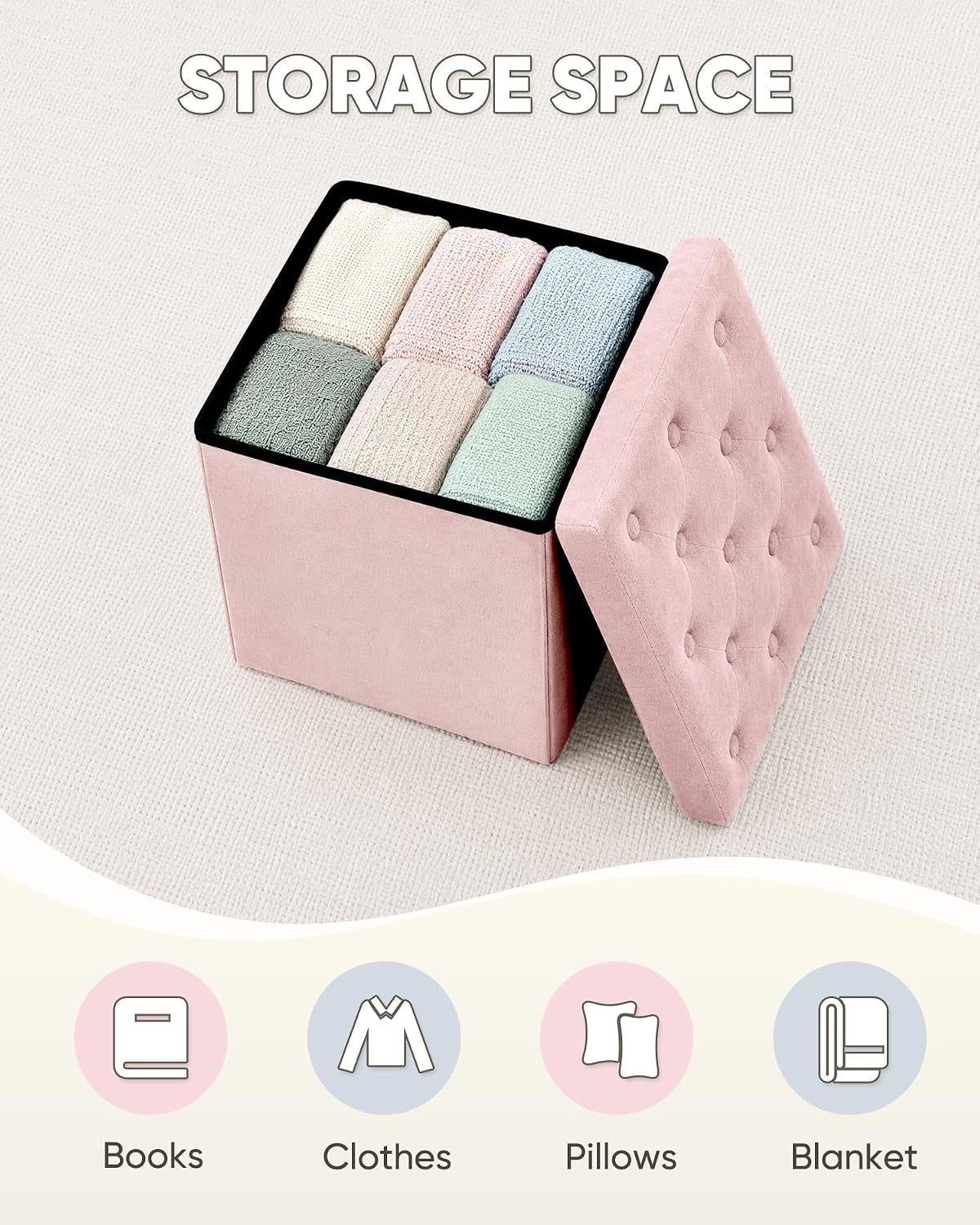 Open pink ottoman showing interior storage filled with folded blankets