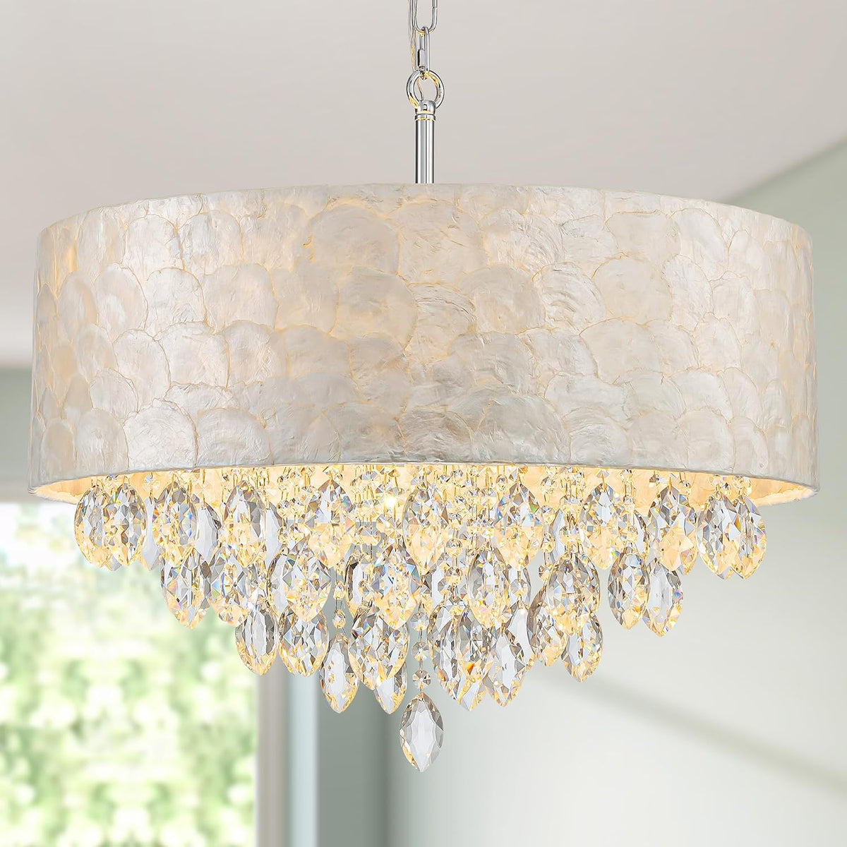 Centered shot of the chandelier showing teardrop crystal strands and a single bottom crystal drop from the shade.