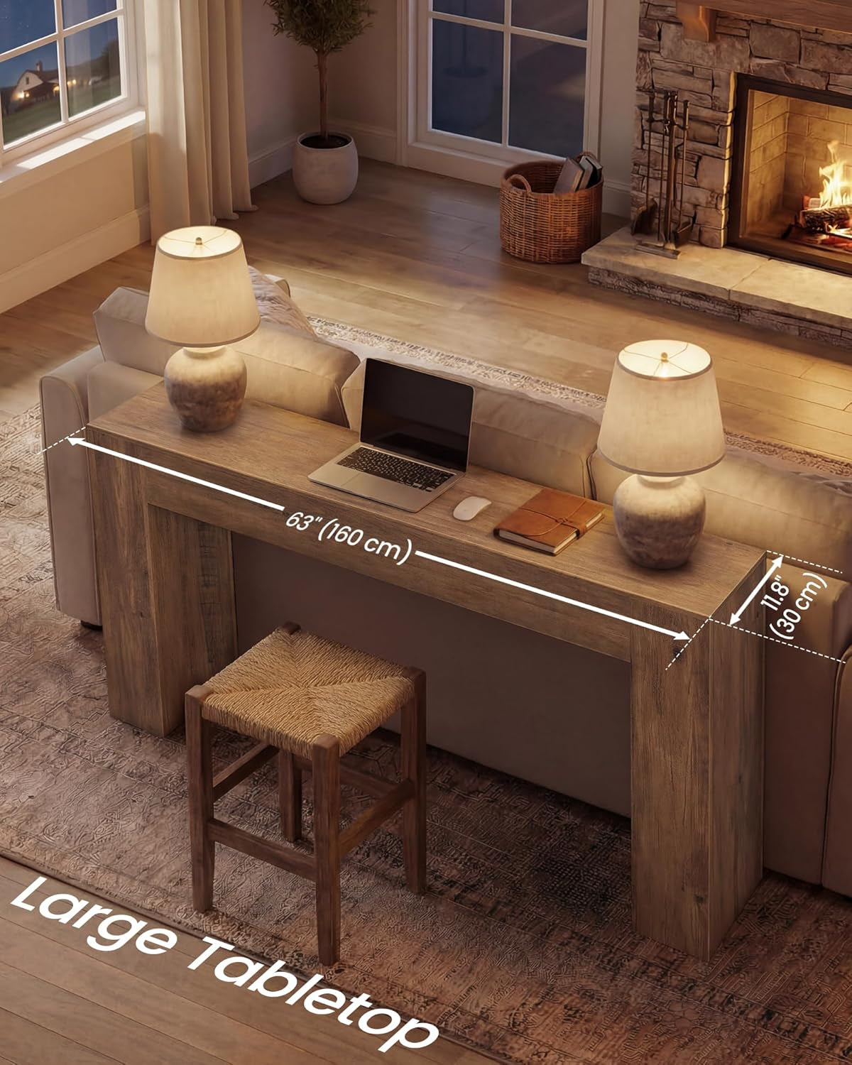 Behind-sofa view of the long narrow console table with two lamps, laptop, and dimension callouts showing 63 inches