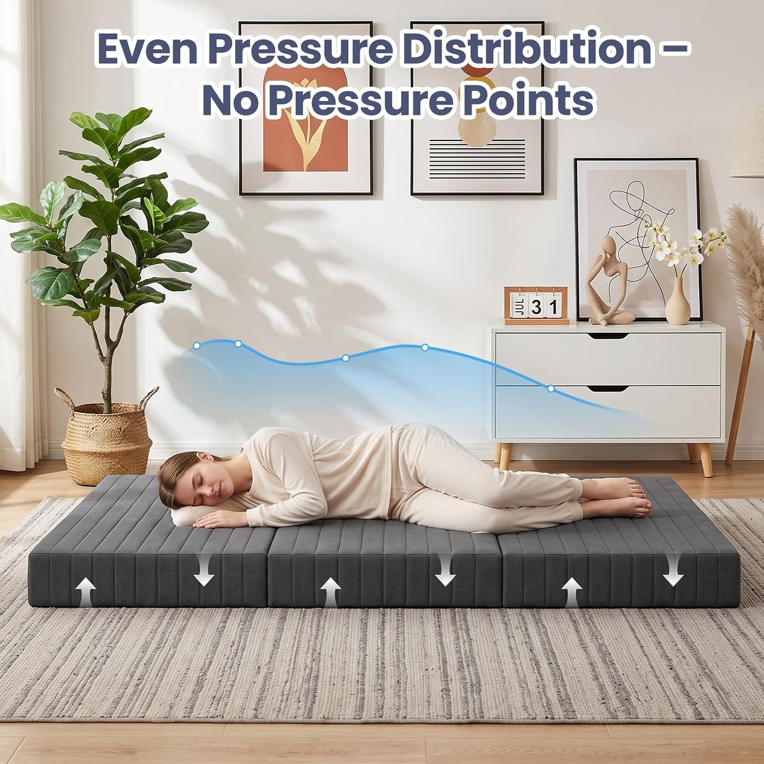 Person lying on flat mattress illustrating even pressure distribution on a rug in a living room