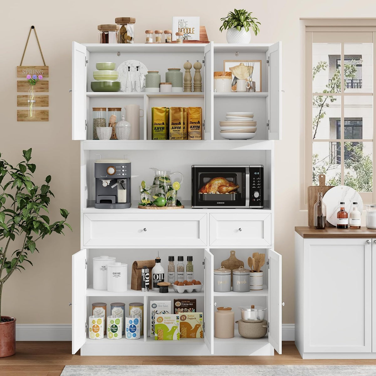 White pantry hutch staged in a kitchen showing a coffee maker and microwave on the 47-inch open countertop with open upper-cb