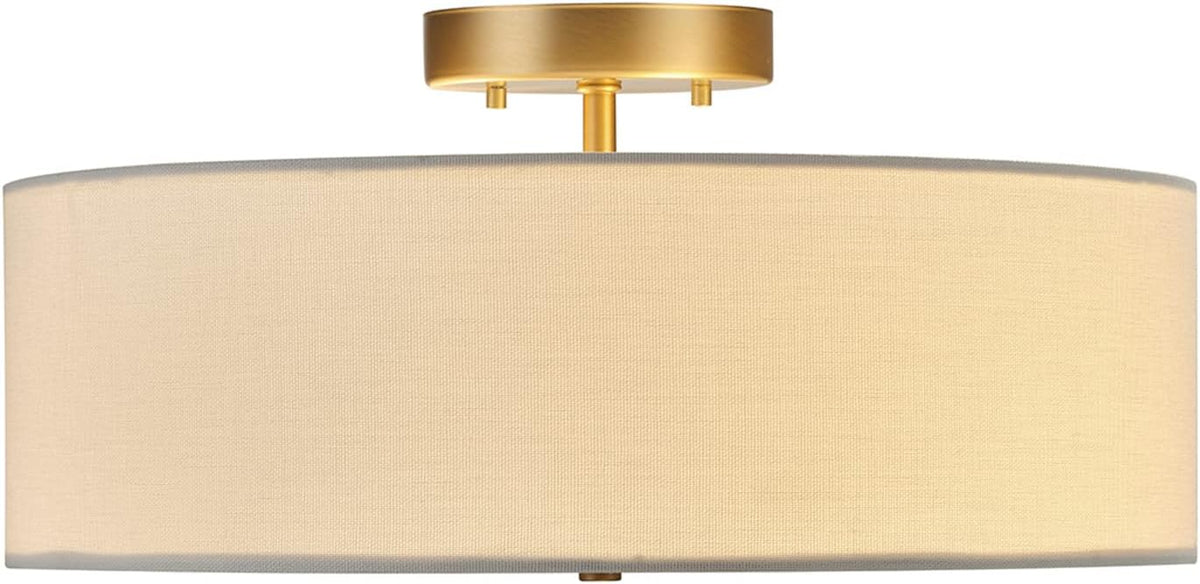 Side profile of the fixture highlighting the low-profile brass mount and cylindrical linen shade.