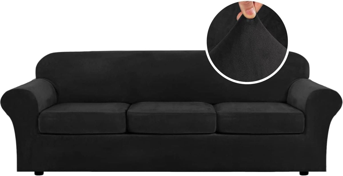 Front-facing three-seat sofa in deep charcoal black showing low round sofa feet and an inset of fabric being stretched.