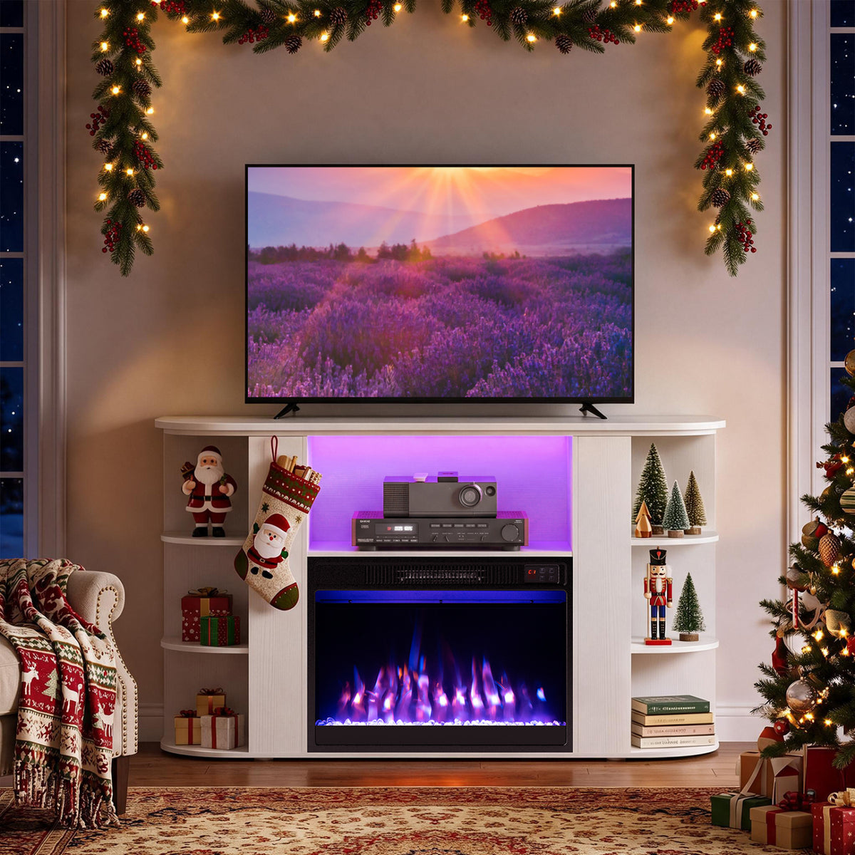 White fireplace TV stand glowing purple and blue in a Christmas-decorated living room.