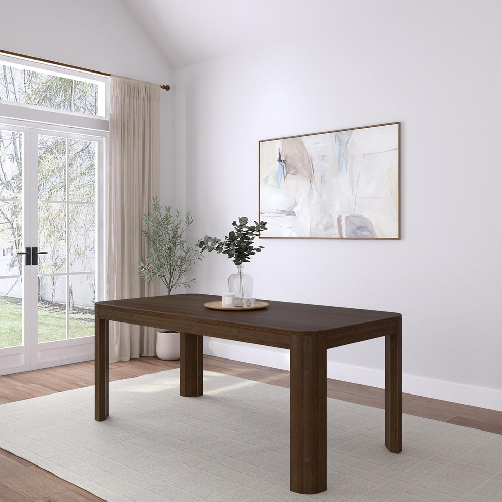 Walnut finish rectangular dining table with rounded legs shown in a bright dining room setting