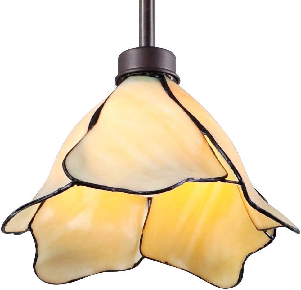 Close-up of lit amber glass shade showing petal-shaped panels and dark soldered edging.
