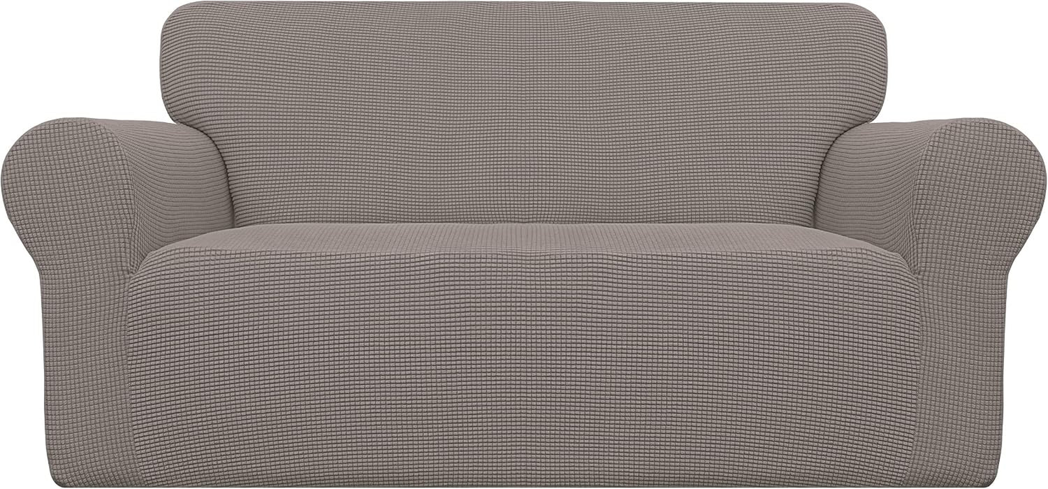 Front view of a two-arm loveseat covered in a textured dark gray stretch slipcover