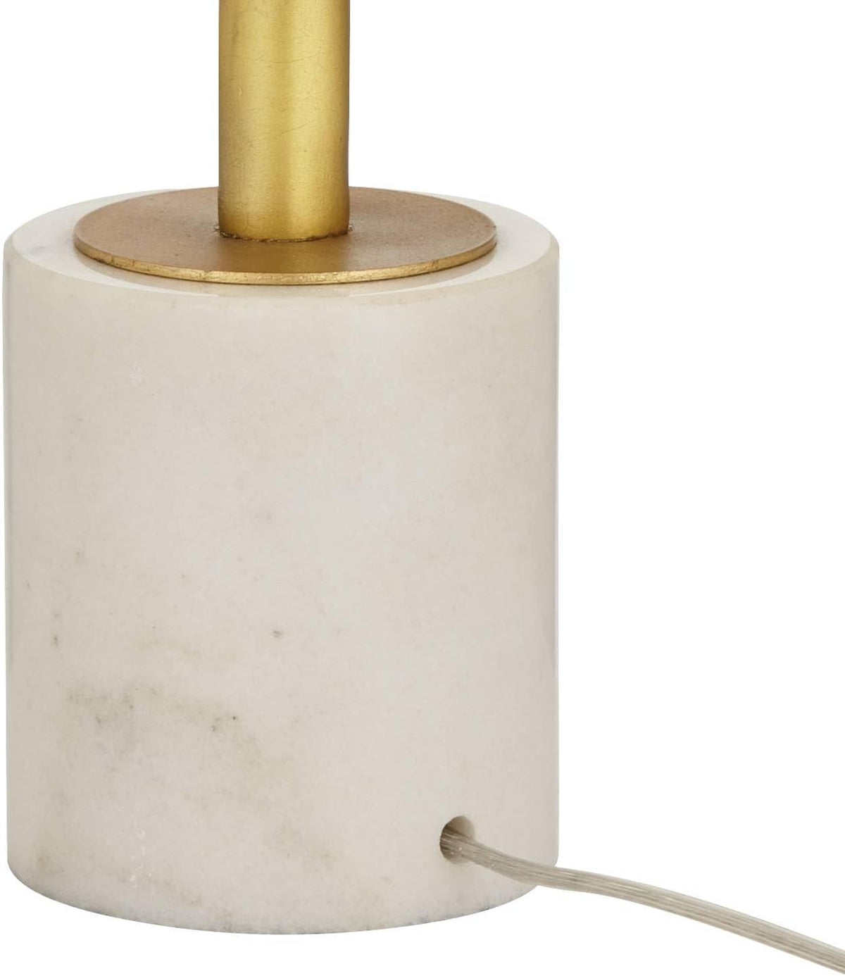 Close crop of the off-white marble cylinder base with a clear power cord routed through a drilled side hole.