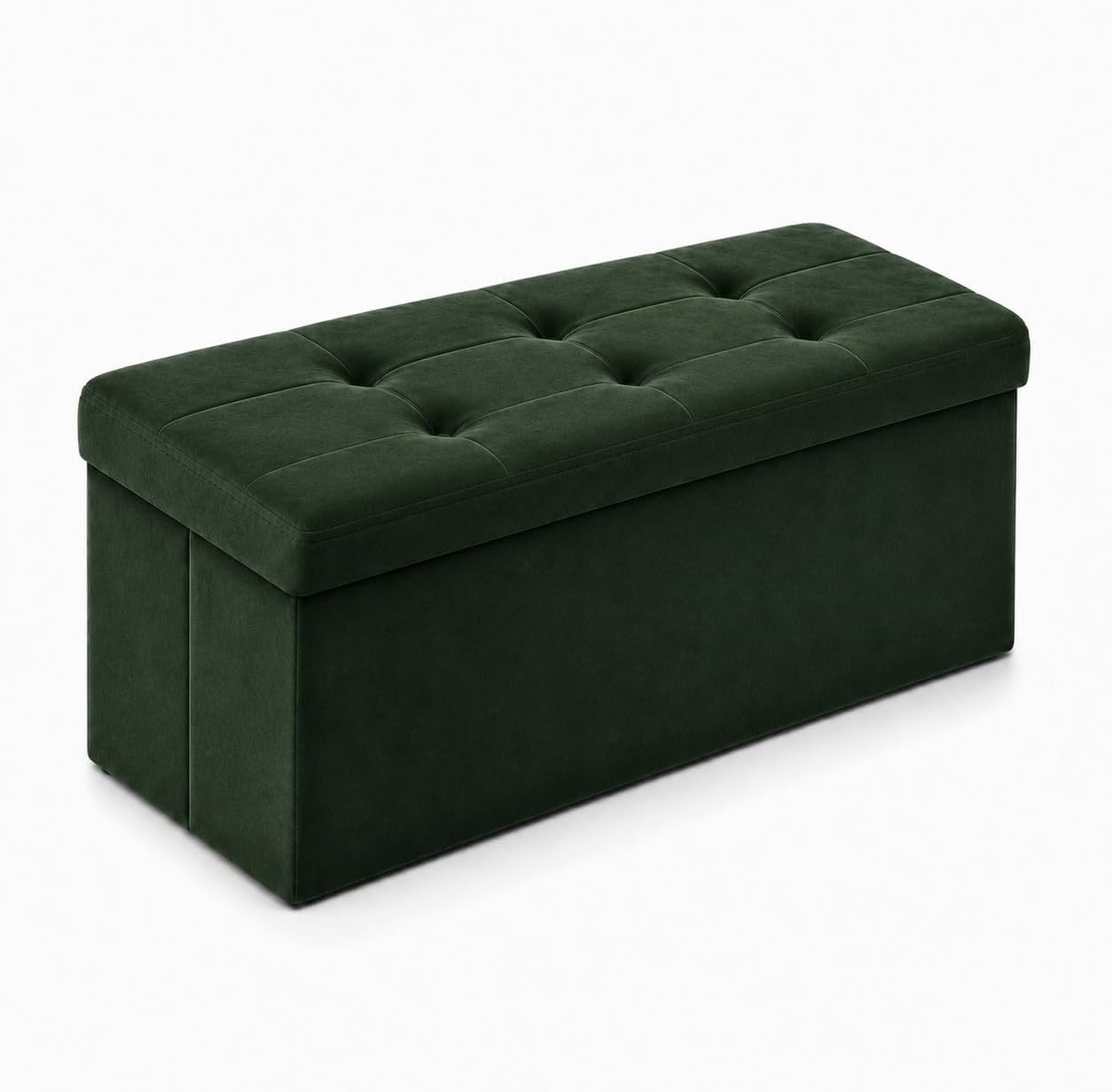 Rectangular tufted storage ottoman in dark green shown at a slight angle on white background.