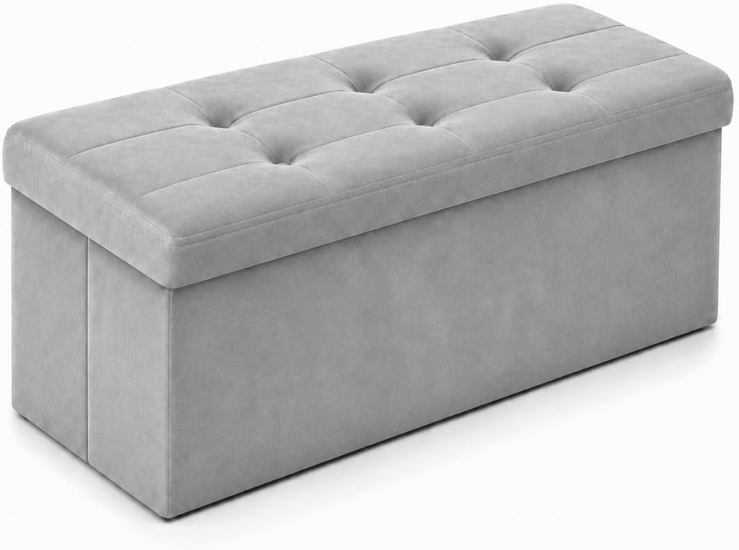Long light gray tufted storage bench ottoman shown from front-left angle