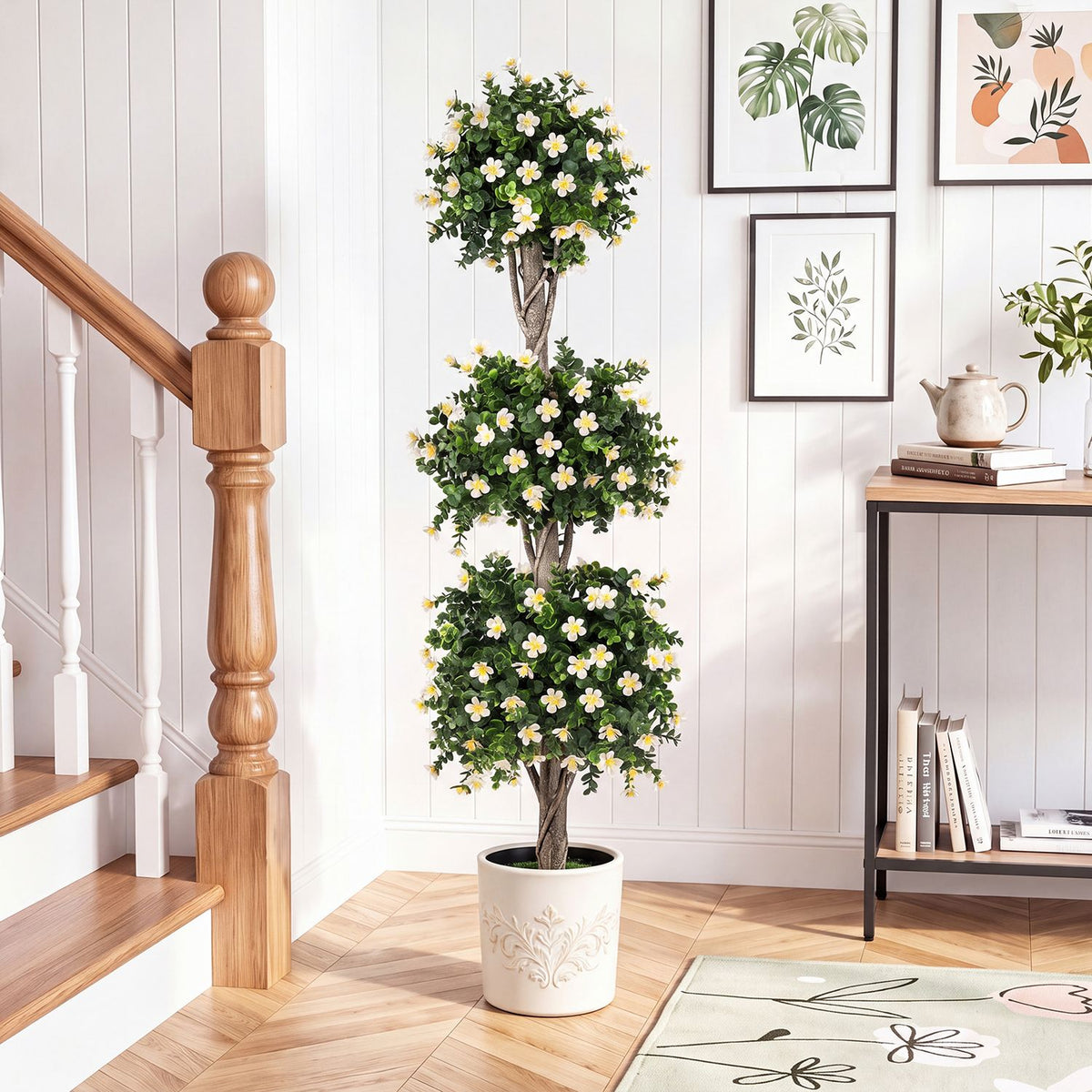 Three-ball green topiary with white and yellow flowers in a decorative pot by a staircase