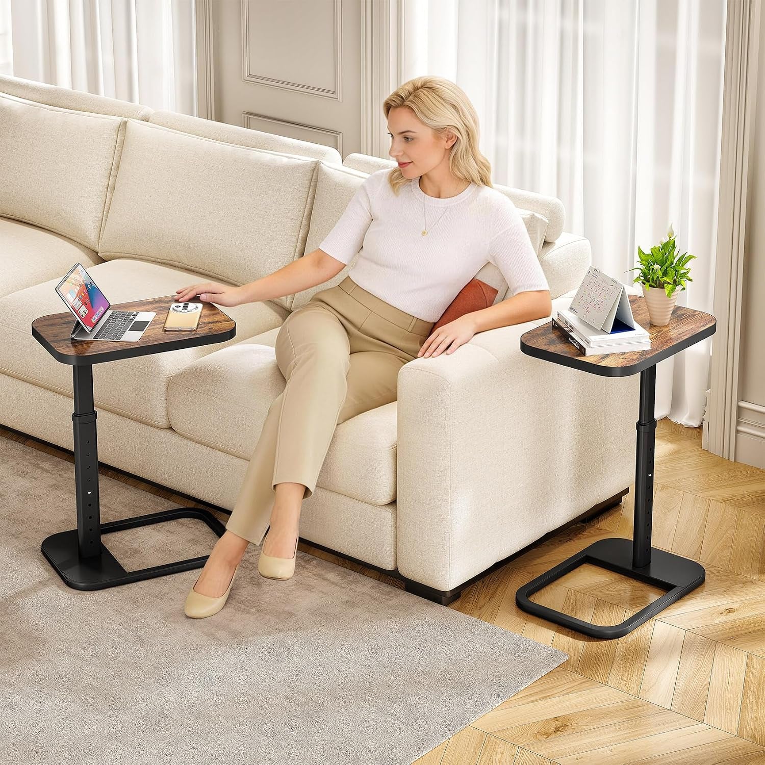 Pair of adjustable C-shaped end tables beside a light fabric sofa in a living room setting