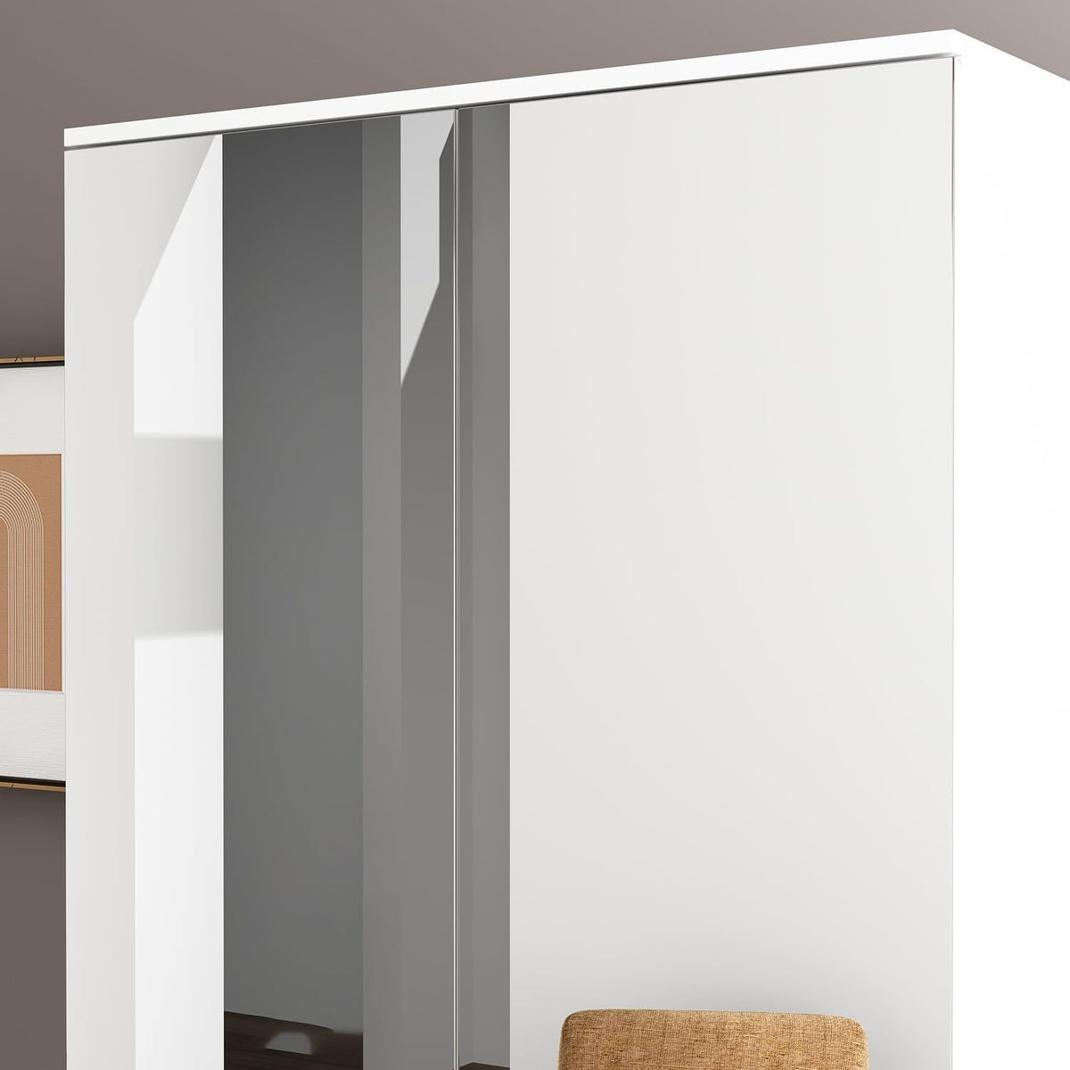 Close-up of the wardrobe's top corner showing a mirrored door edge and the smooth white exterior finish