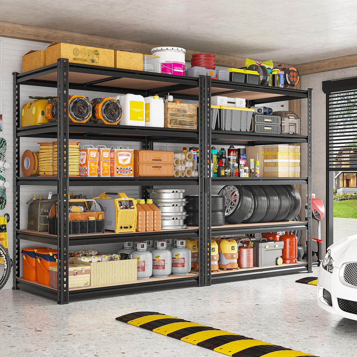 Black garage shelving loaded with storage bins, tools, containers and tires