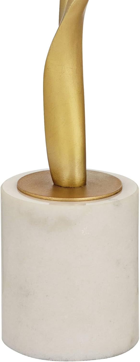 Close-up of the white marble cylindrical base with the gold column mounting plate