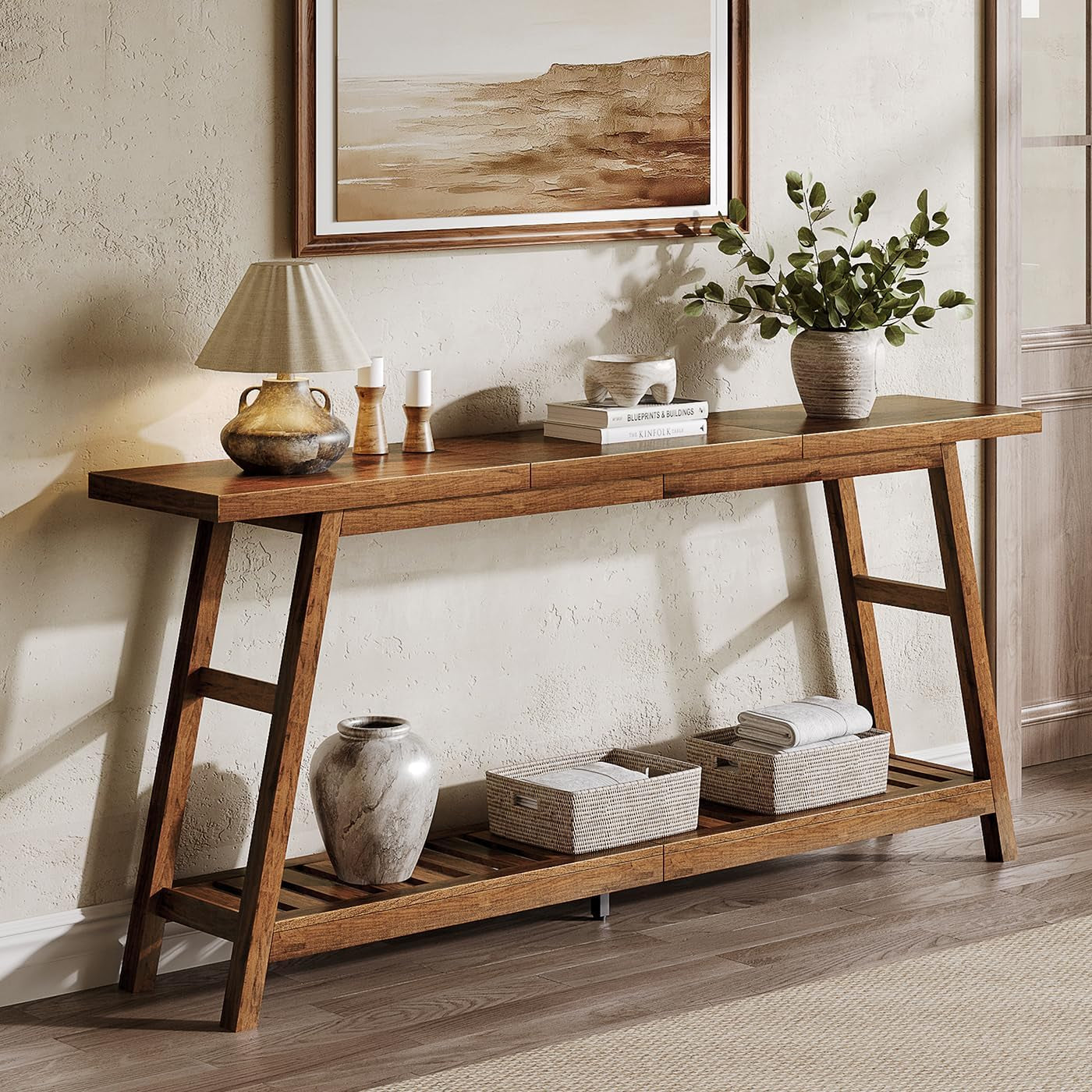 Side view of the console table against a wall with a lamp, books, and woven baskets on the lower slatted shelf