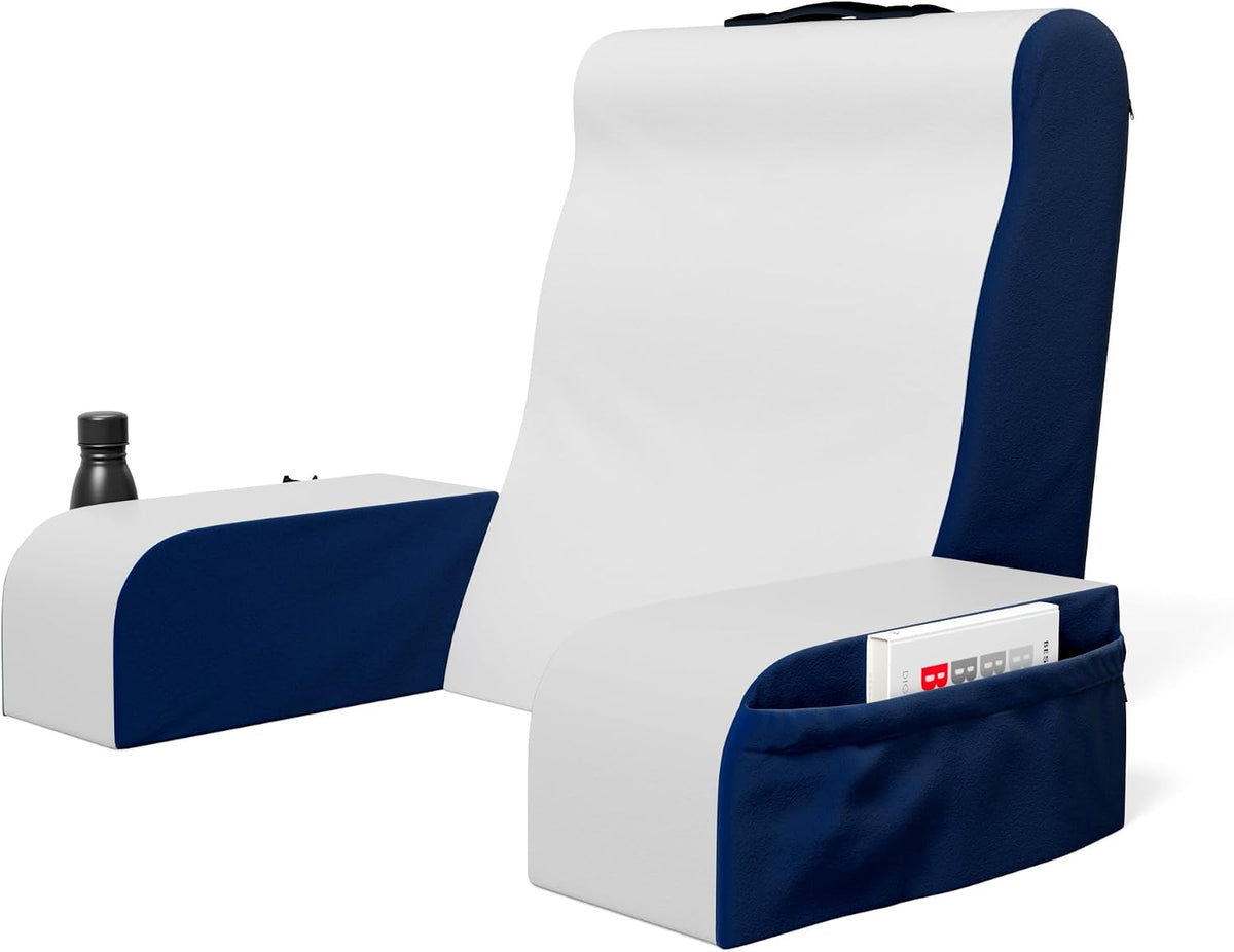 Three-quarter view of wedge pillow with navy blue side panels, armrests holding a water bottle and a fabric pocket with a