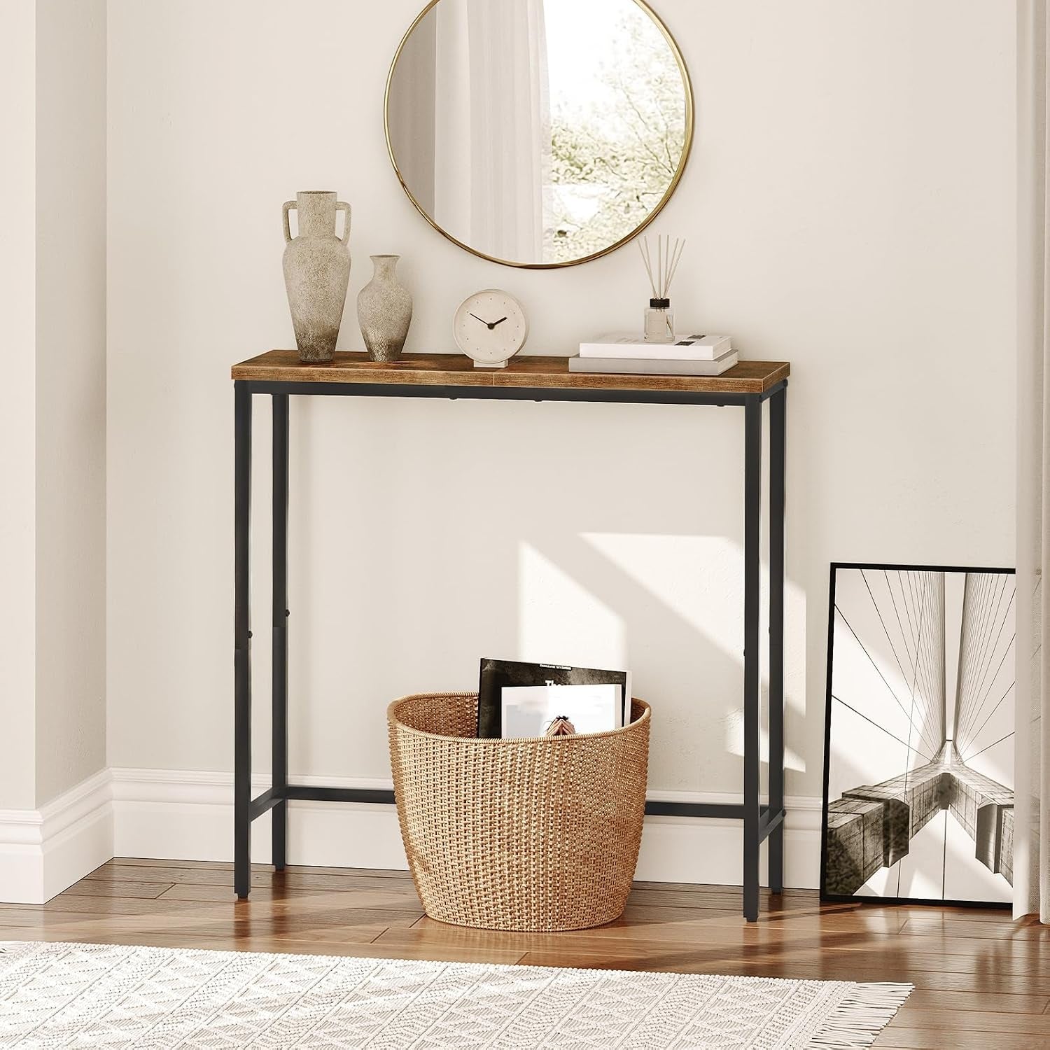 Slim rustic console table in a small hallway vignette with a woven basket on the floor