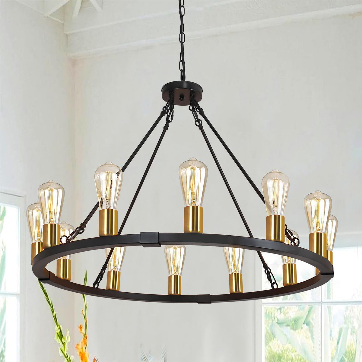 Close-up showing the chandelier's metal ring with gold-tone bulb sockets and exposed Edison-style bulbs.