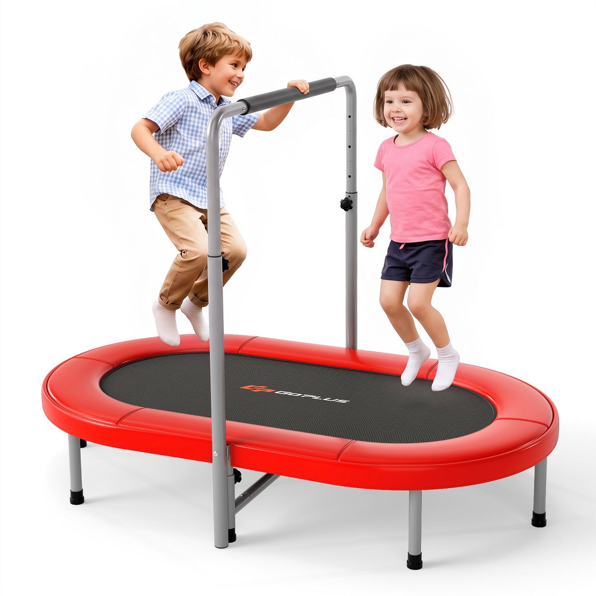 Two children jump on a red trampoline, with one holding the padded support bar.