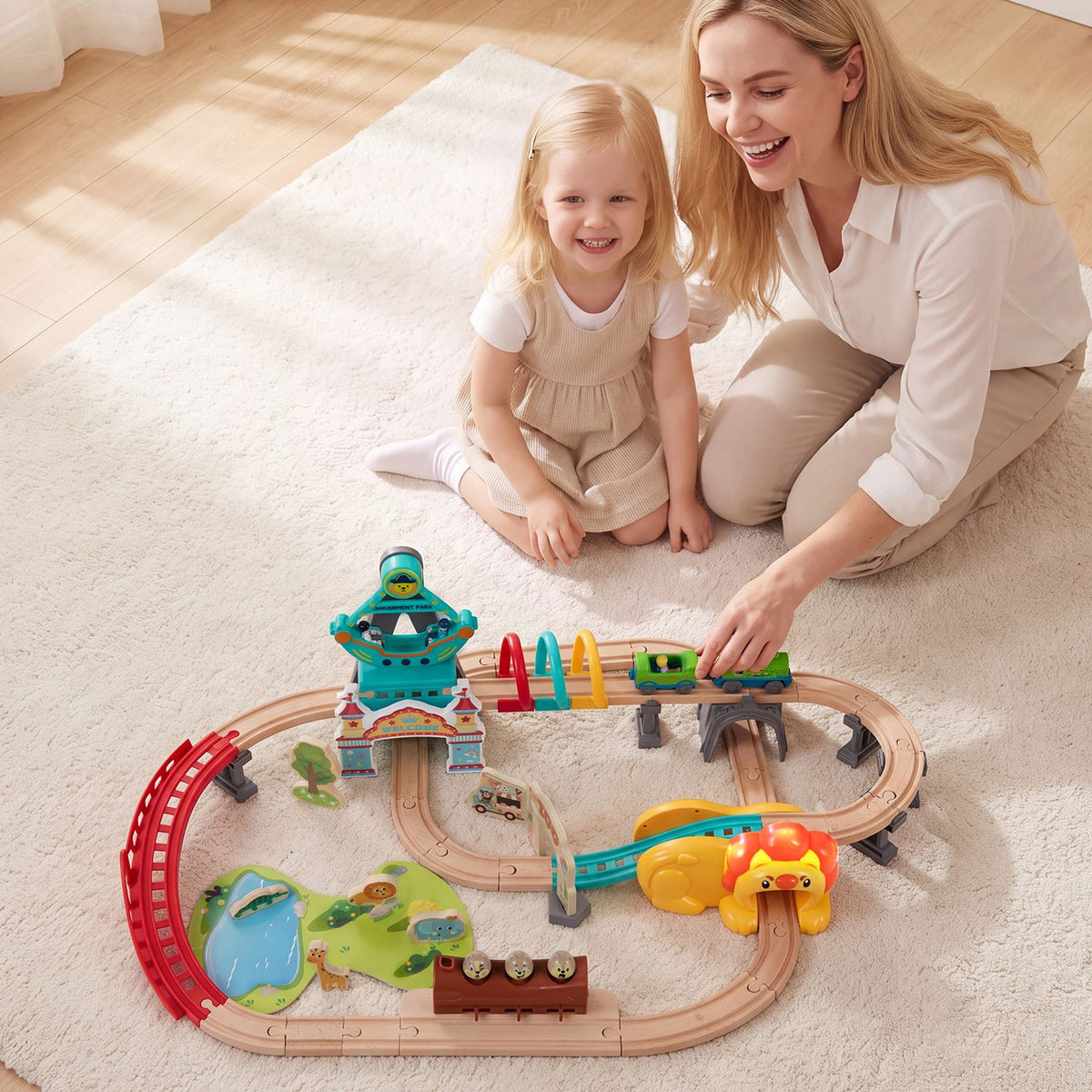 A child and adult play with a colorful wooden train set spread across a rug.