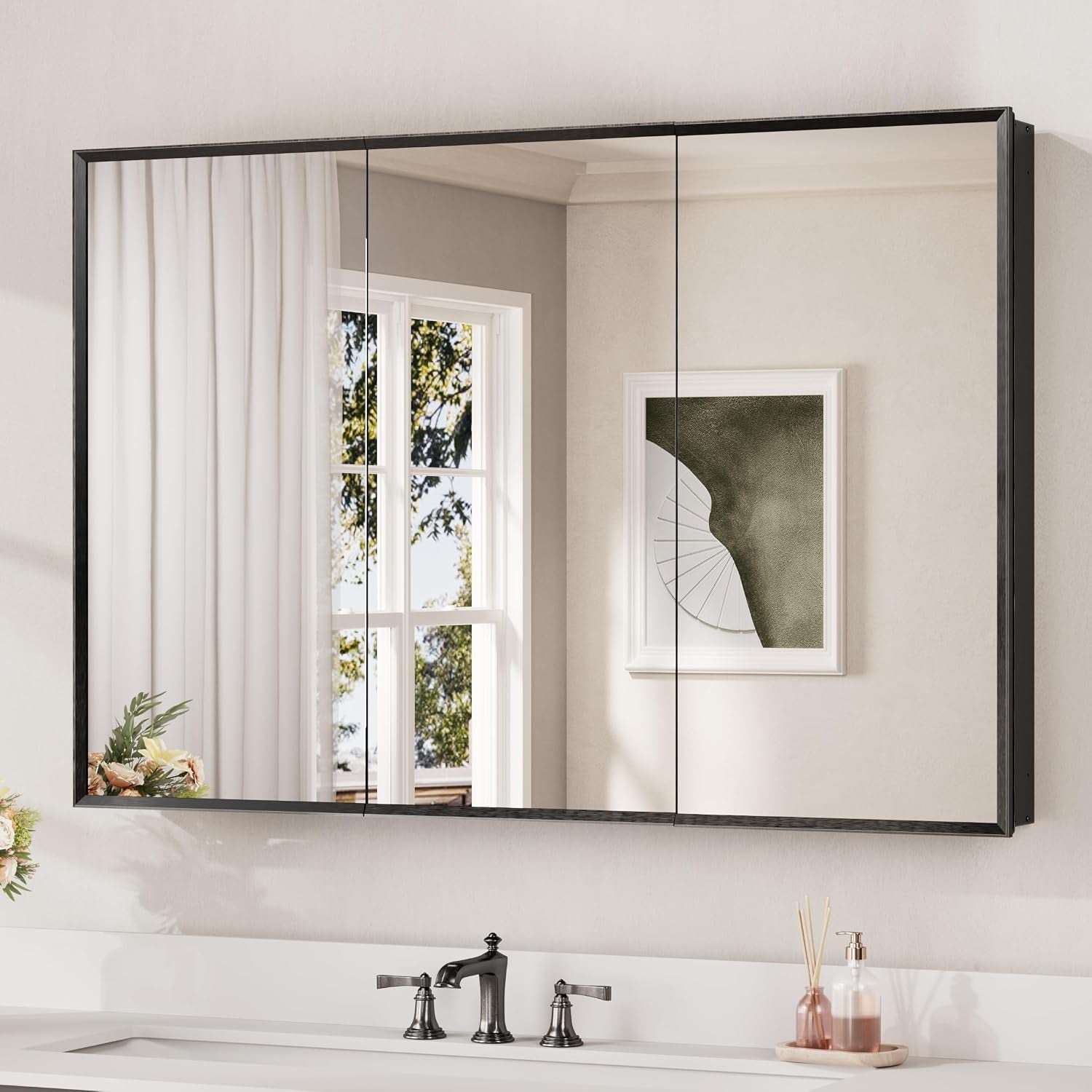 Wide three-door mirrored medicine cabinet with a slim black frame over a double-handle faucet