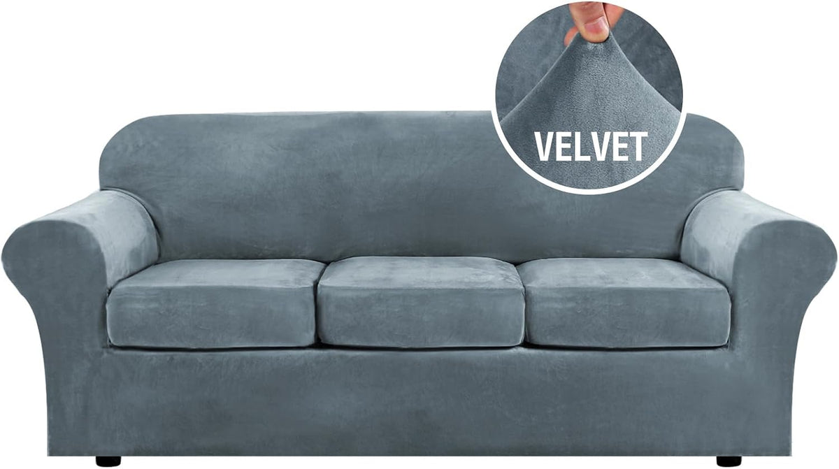 Front-facing three-seat sofa in slate blue velvet with three separate seat cushions and a circular fabric pinch inset.