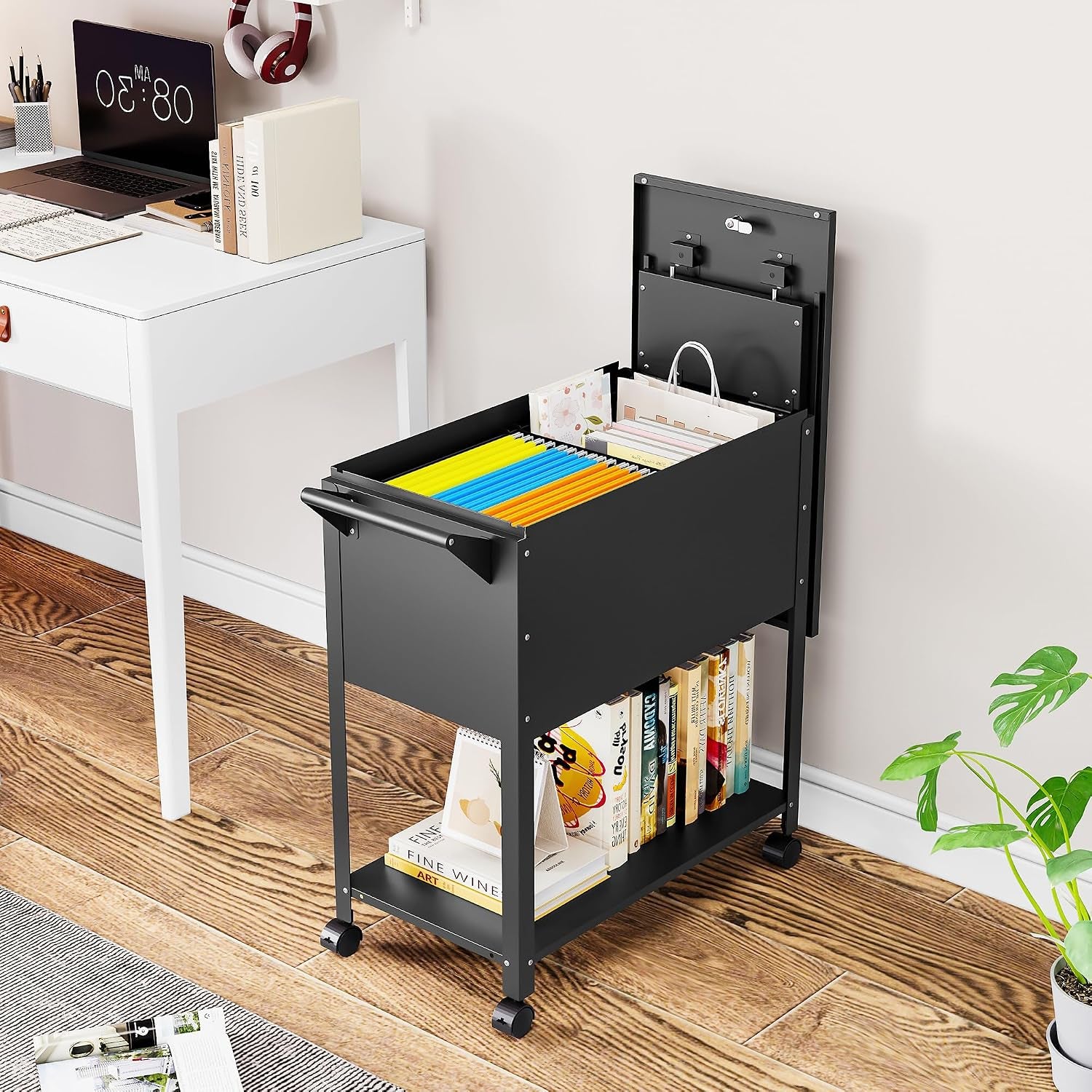 Black rolling file cart beside a white desk in a home office setting with lid open and lower shelf storing books