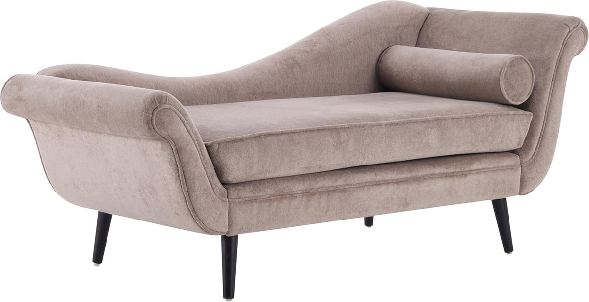 Three-quarter angled view of the chaise highlighting curved back, bolster pillow and splayed wooden legs