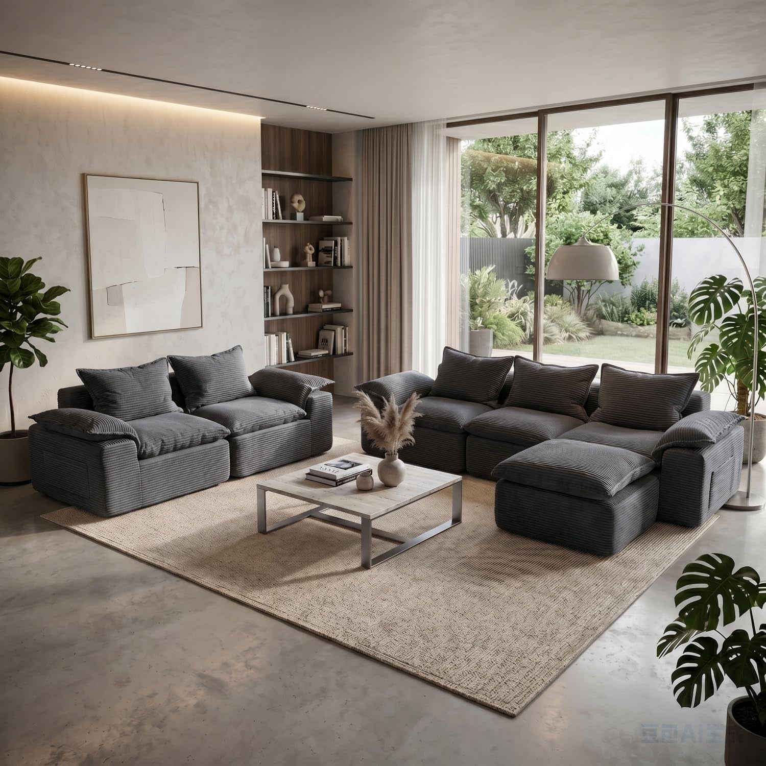 Wide view of matching dark charcoal modular sofas forming an L-shape around a low coffee table.