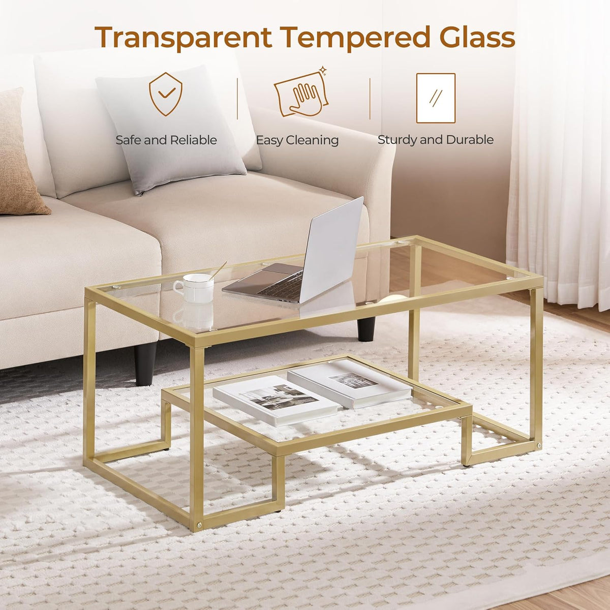 Angled view of gold two-tier glass coffee table highlighting transparent tempered glass top and lower shelf
