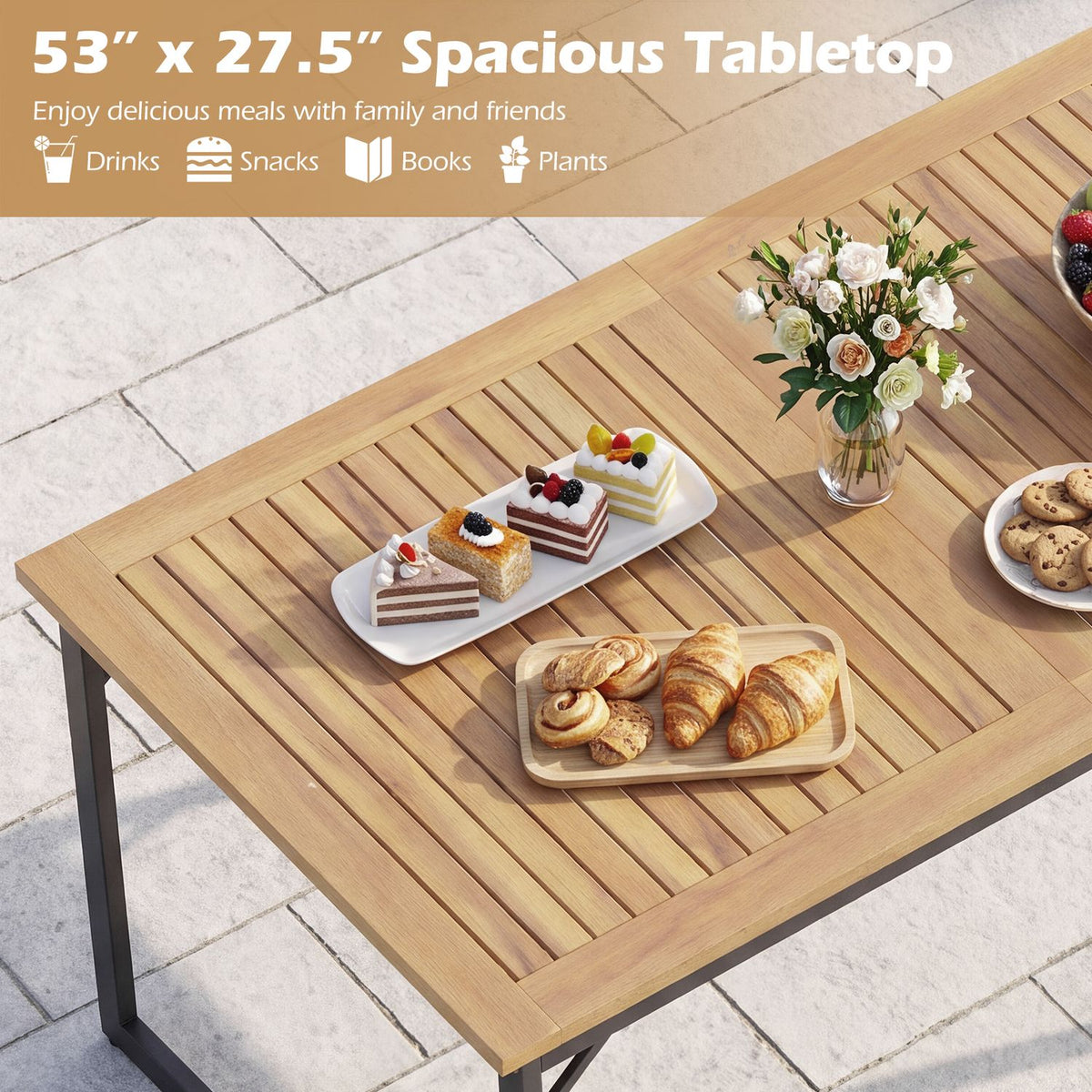 Close view of the slatted tabletop arranged with pastries, cake, cookies, and flowers.