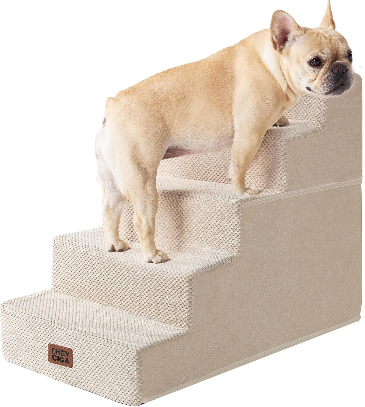 Side view of beige four-step pet stairs with a small French bulldog standing on the second-highest step