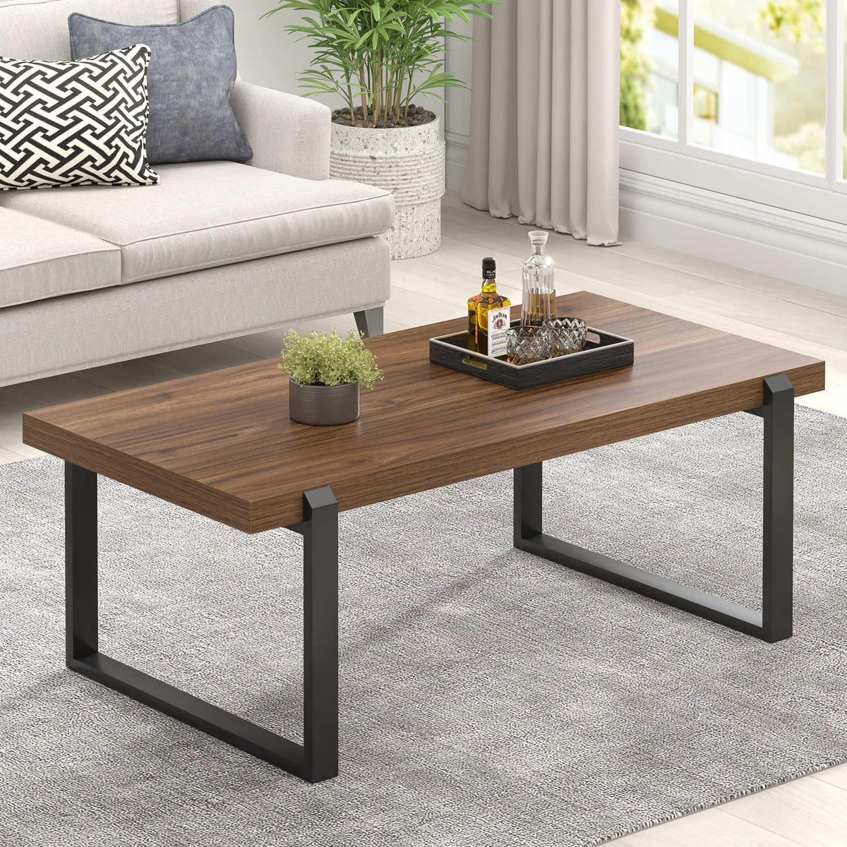 Rustic oak wood-grain tabletop with black metal U-shaped legs, shown from a low angled side view.