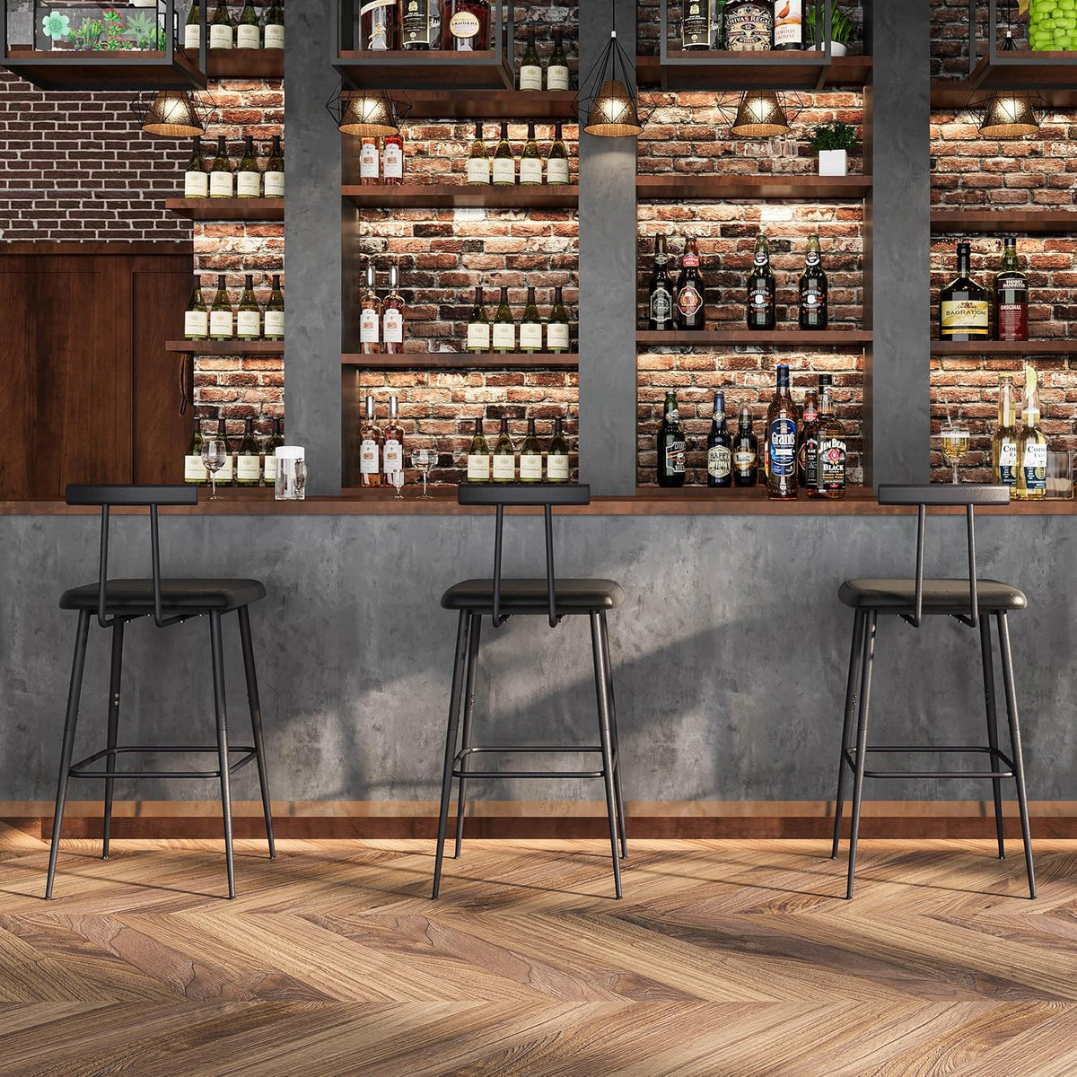 Three black barstools lined at a wooden bar in a brick-walled bar setting with bottles on shelves.