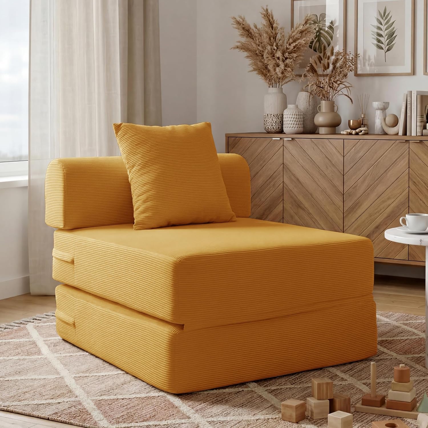 Mustard yellow corduroy folding chair configuration on a patterned round rug near wooden sideboard