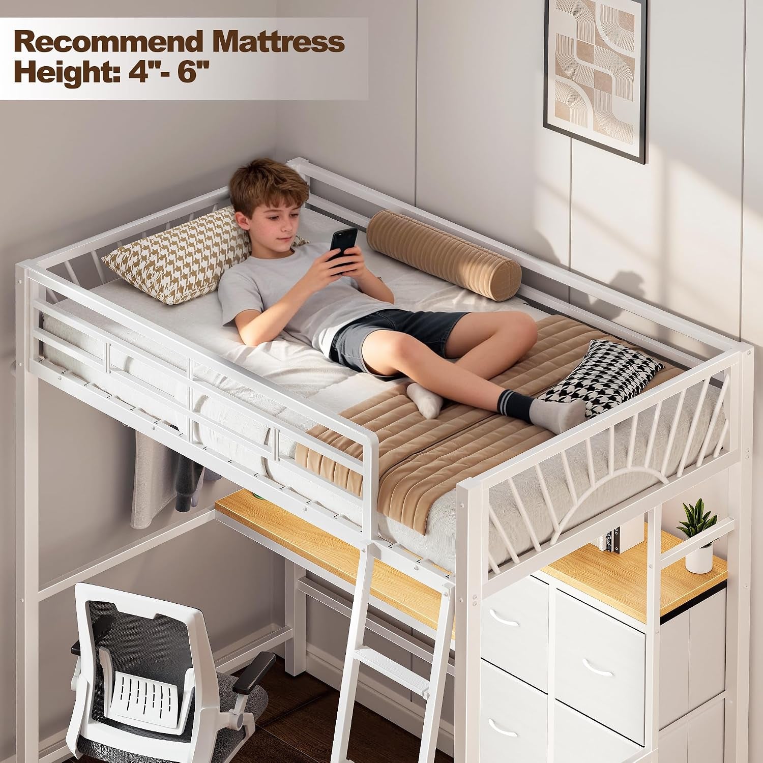 Overhead view of a white loft bed with a boy lying on the mattress, ladder, desk surface and stacked drawers underneath.