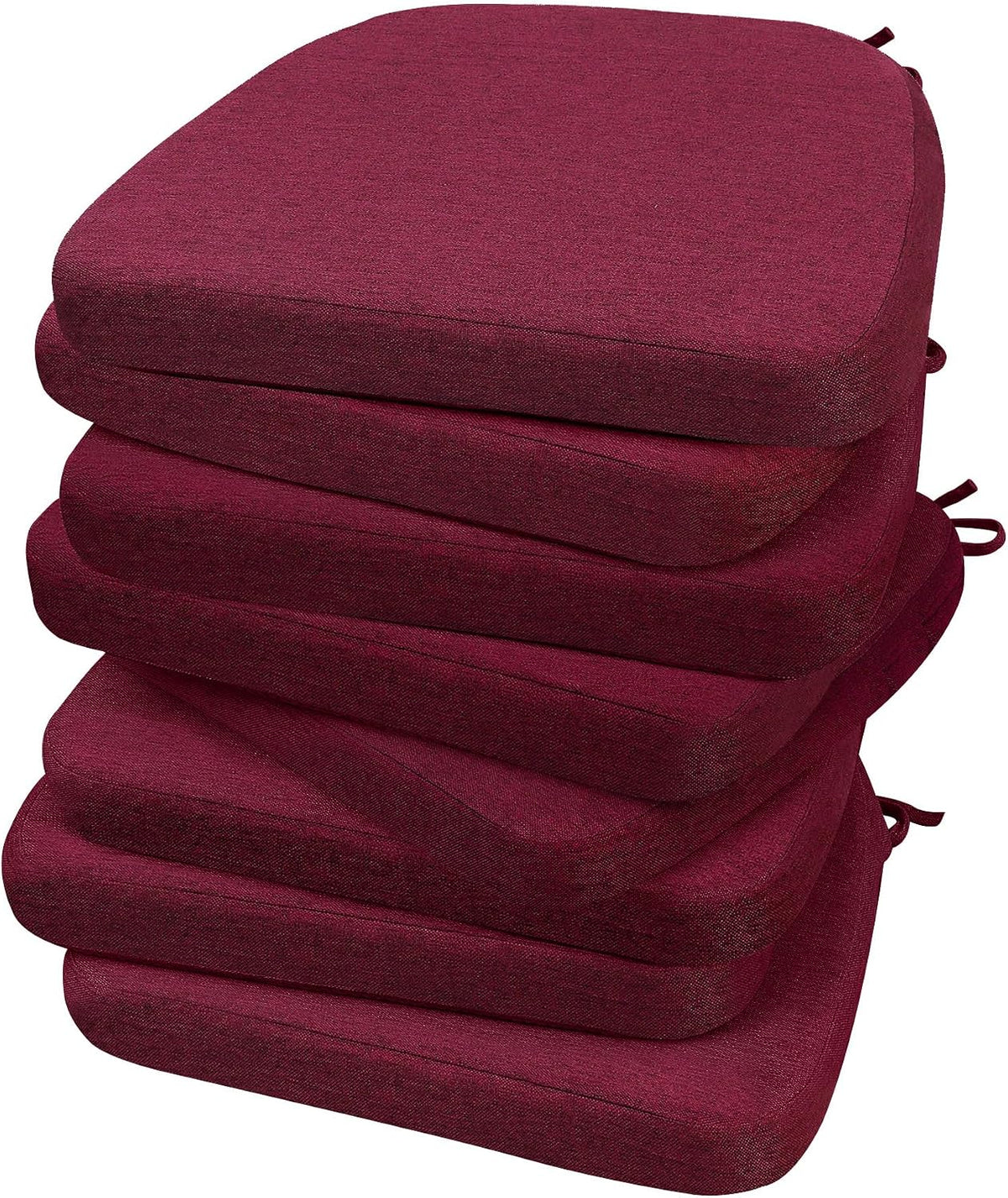 Tall stack of six D-shaped burgundy chair cushions with ties peeking from the right side.