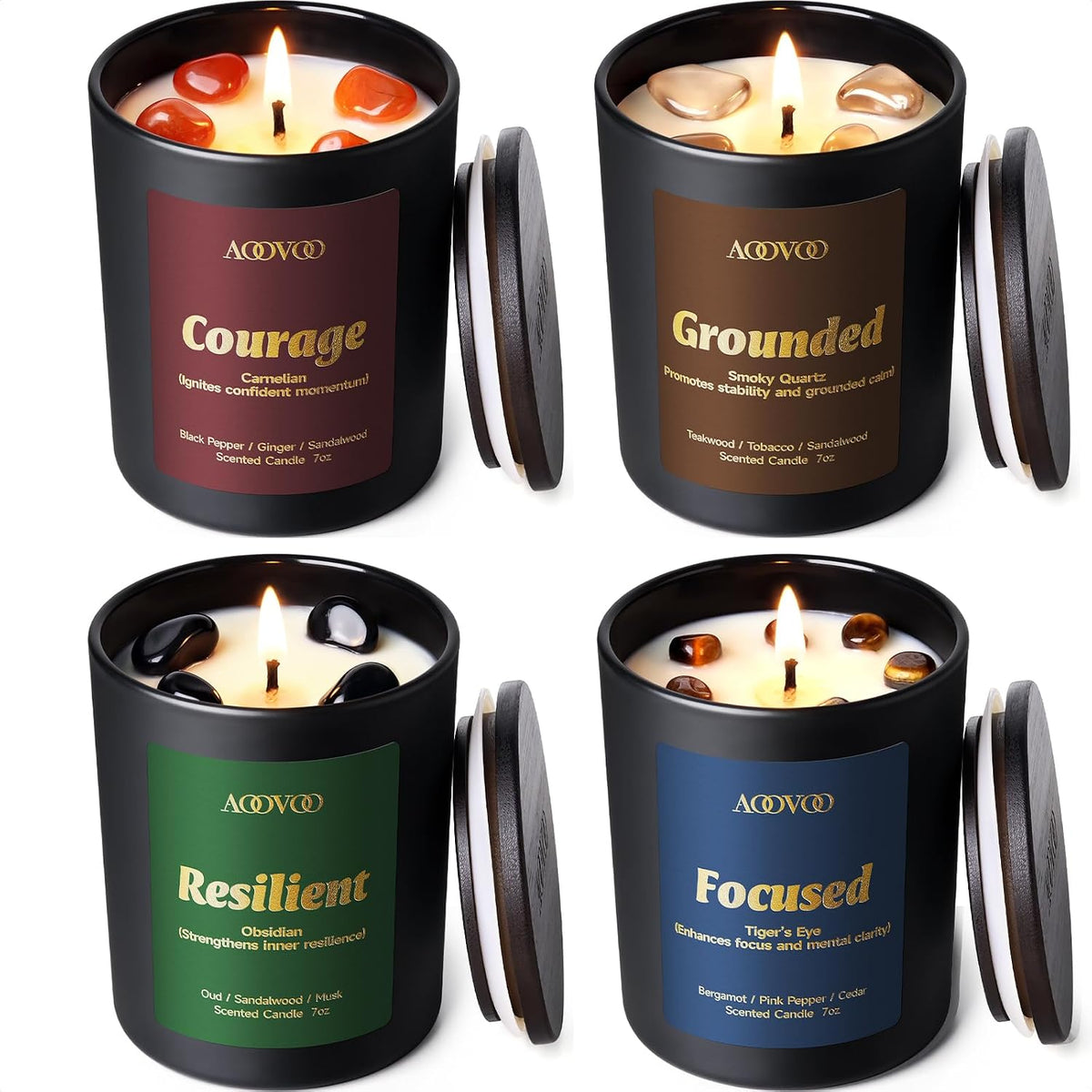 Four matte black candles in a grid, each topped with polished gemstone accents and two showing active flames.