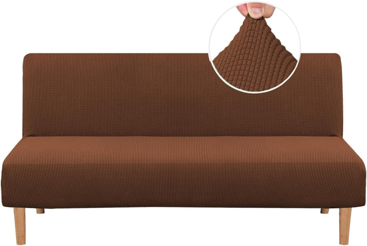 Straight-on view of a futon dressed in a brown small-check jacquard slipcover, wooden legs visible and circular fabric