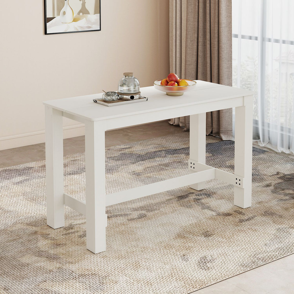 White rectangular table with a tea tray and fruit bowl in a softly lit room.