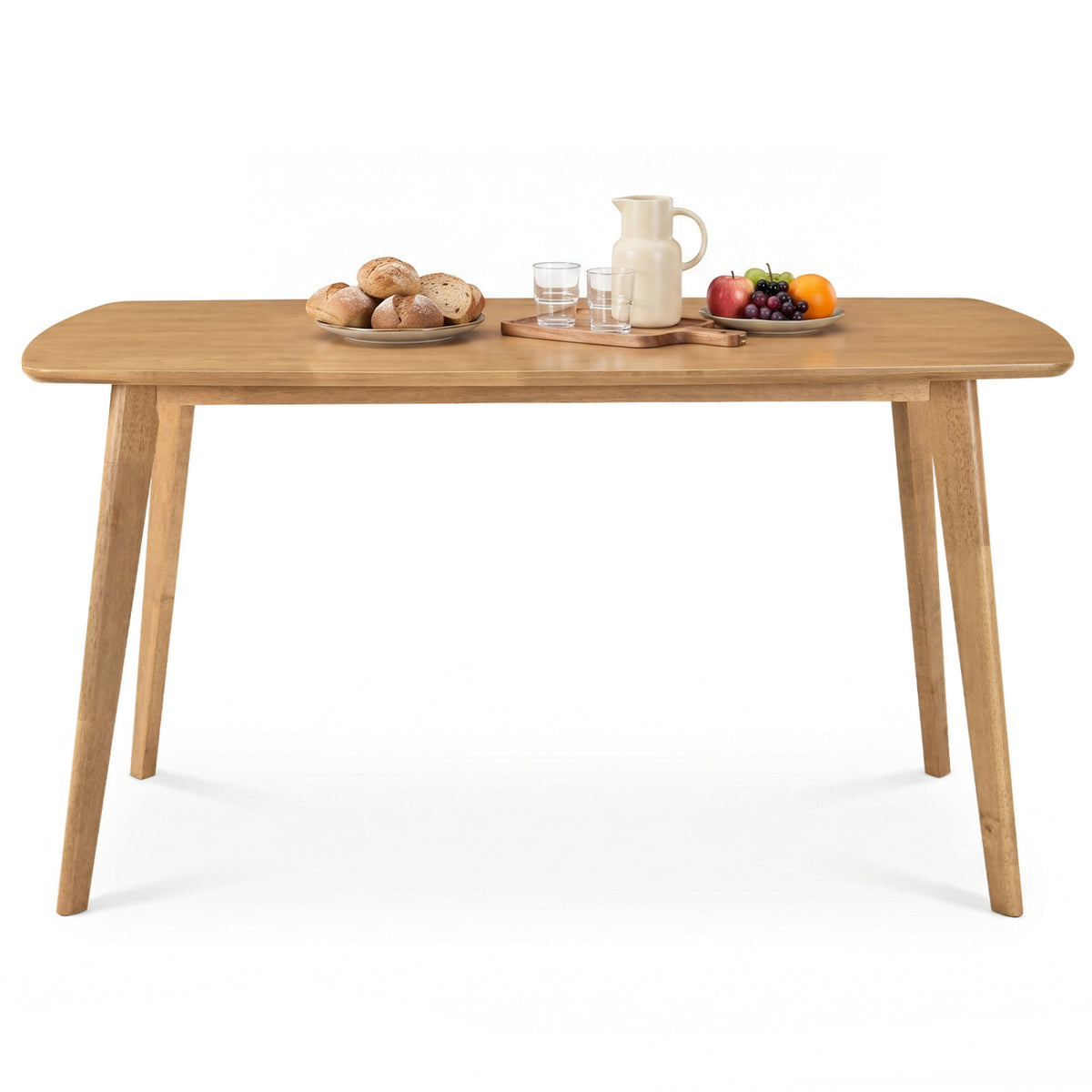 Natural wood dining table shown from the front with food and drinks