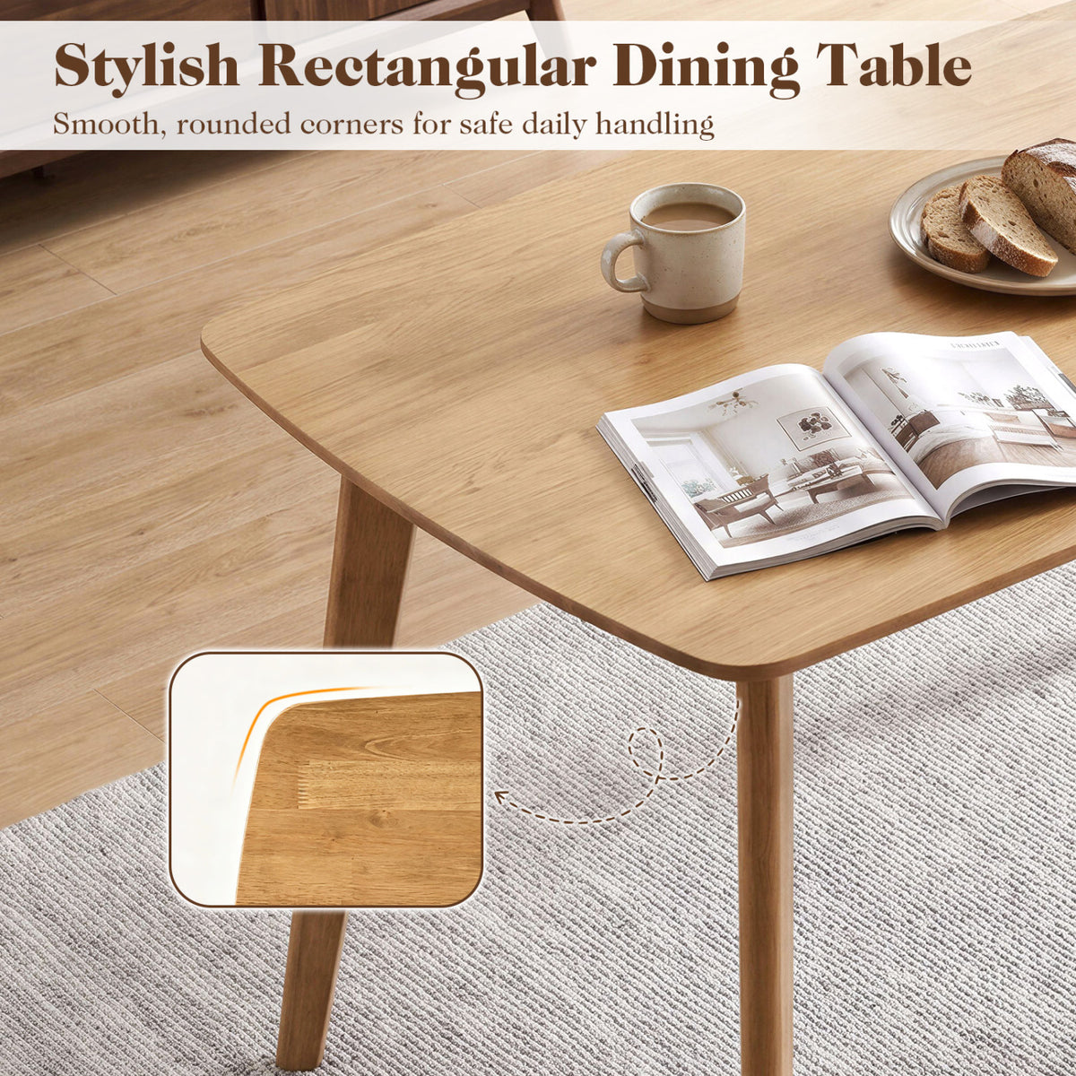 Close view of the table’s rounded tabletop corner and wood grain, with a mug and open book on top.