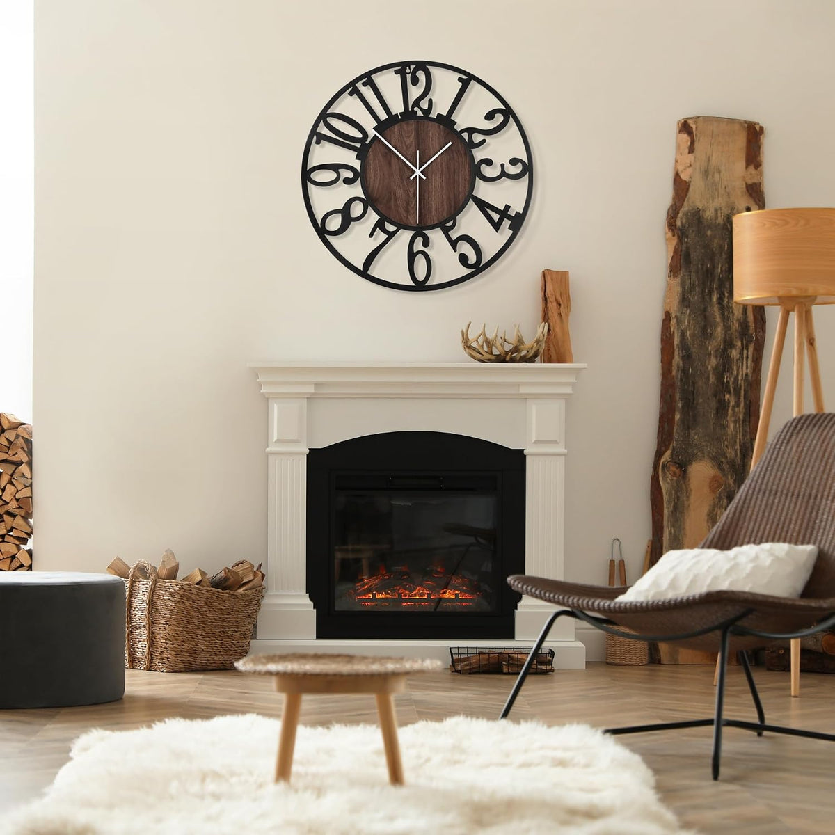 Wall clock mounted above a white fireplace in a neutral living room setting with decorative accents